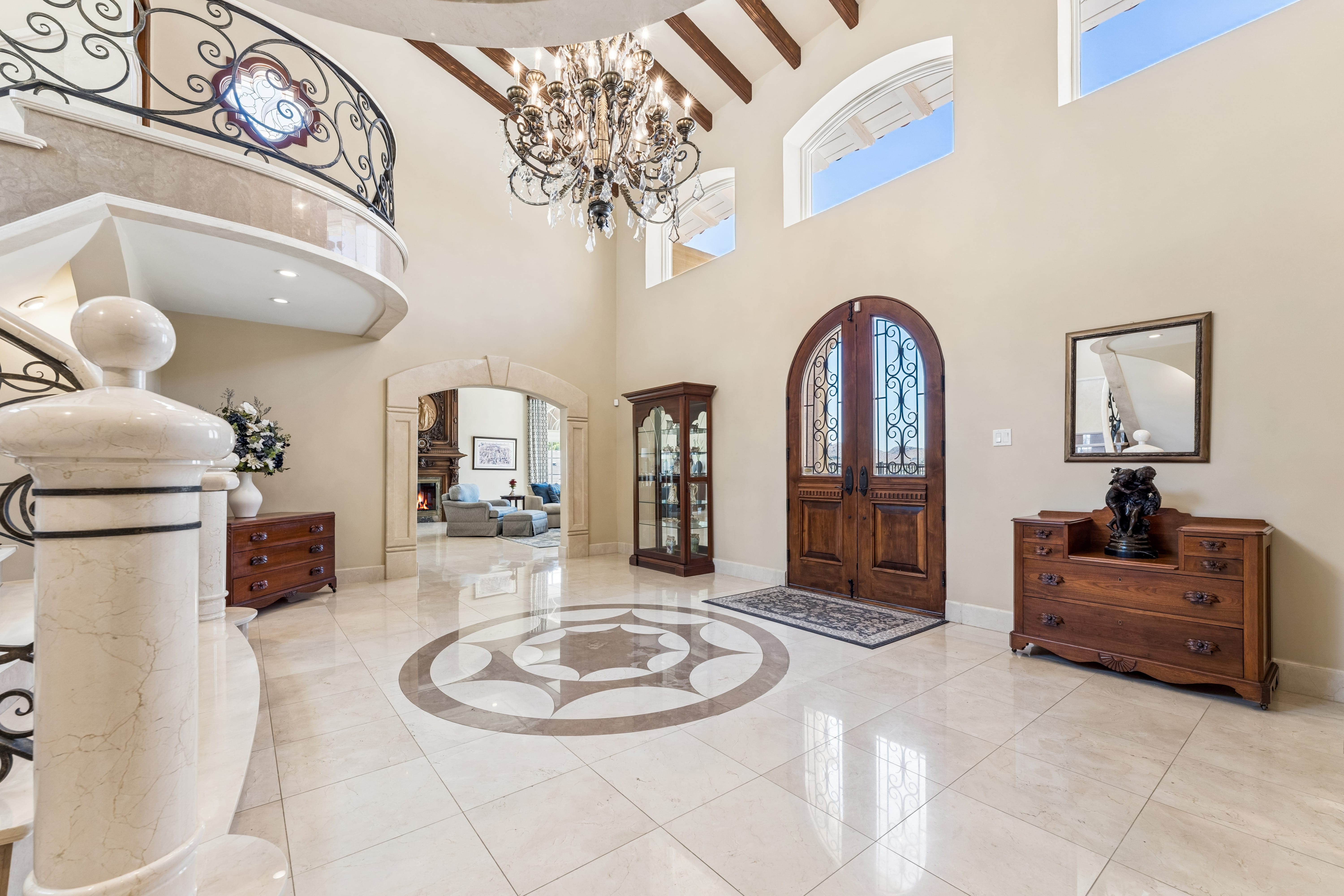 Foyer entry doors and marble medallion floor