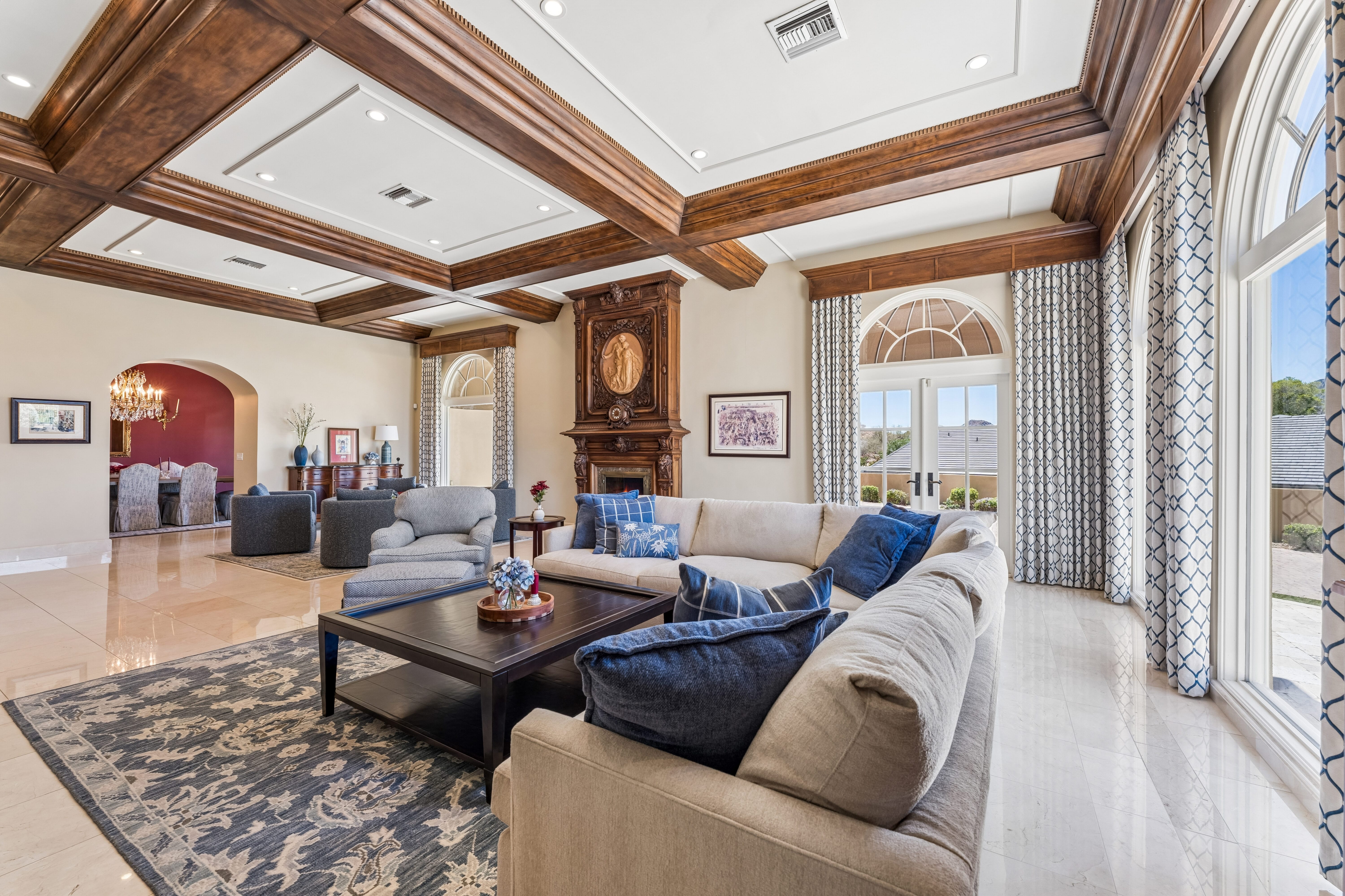 Grand living room with fireplace and mountain views