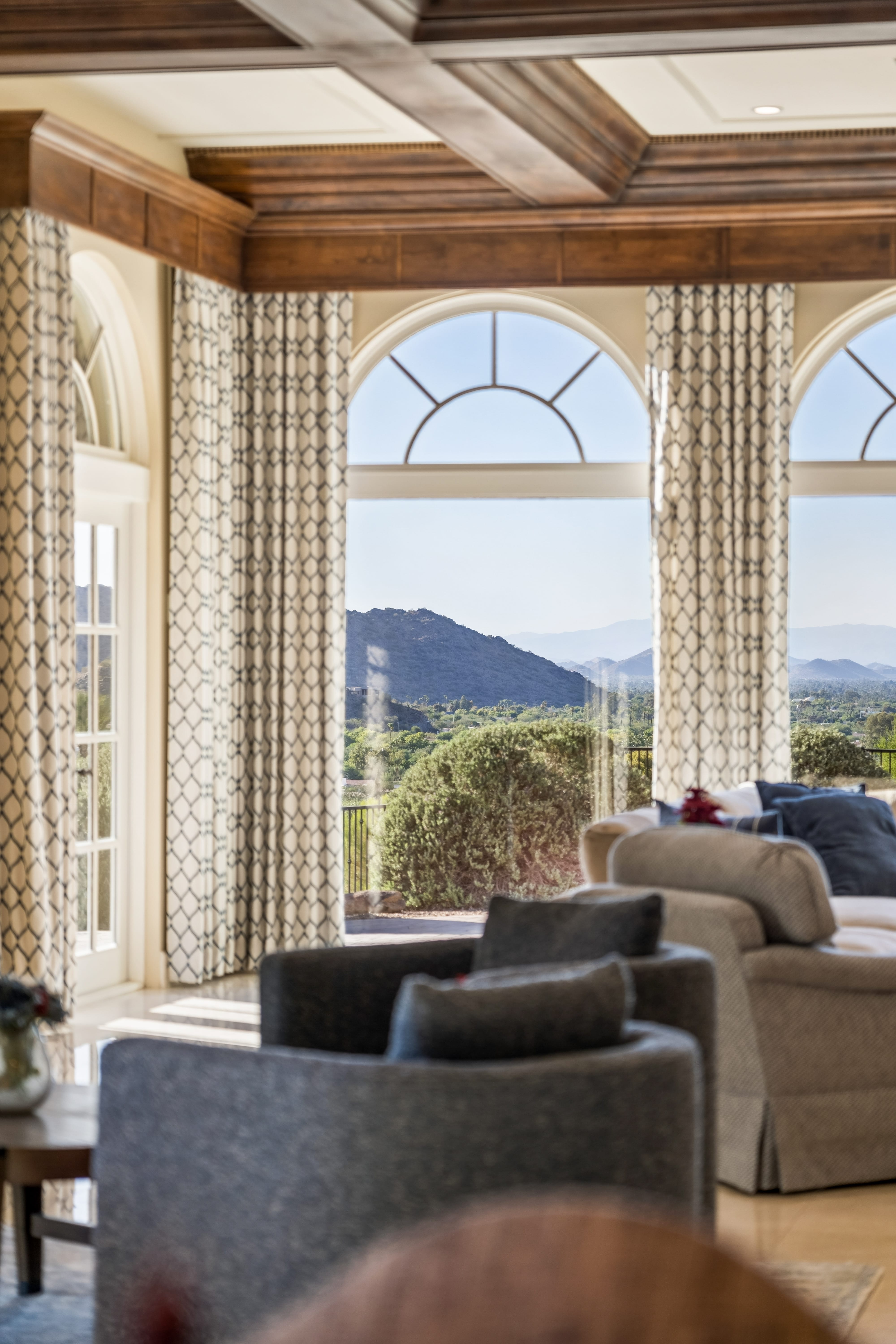 Arched windows framing Mummy Mountain view