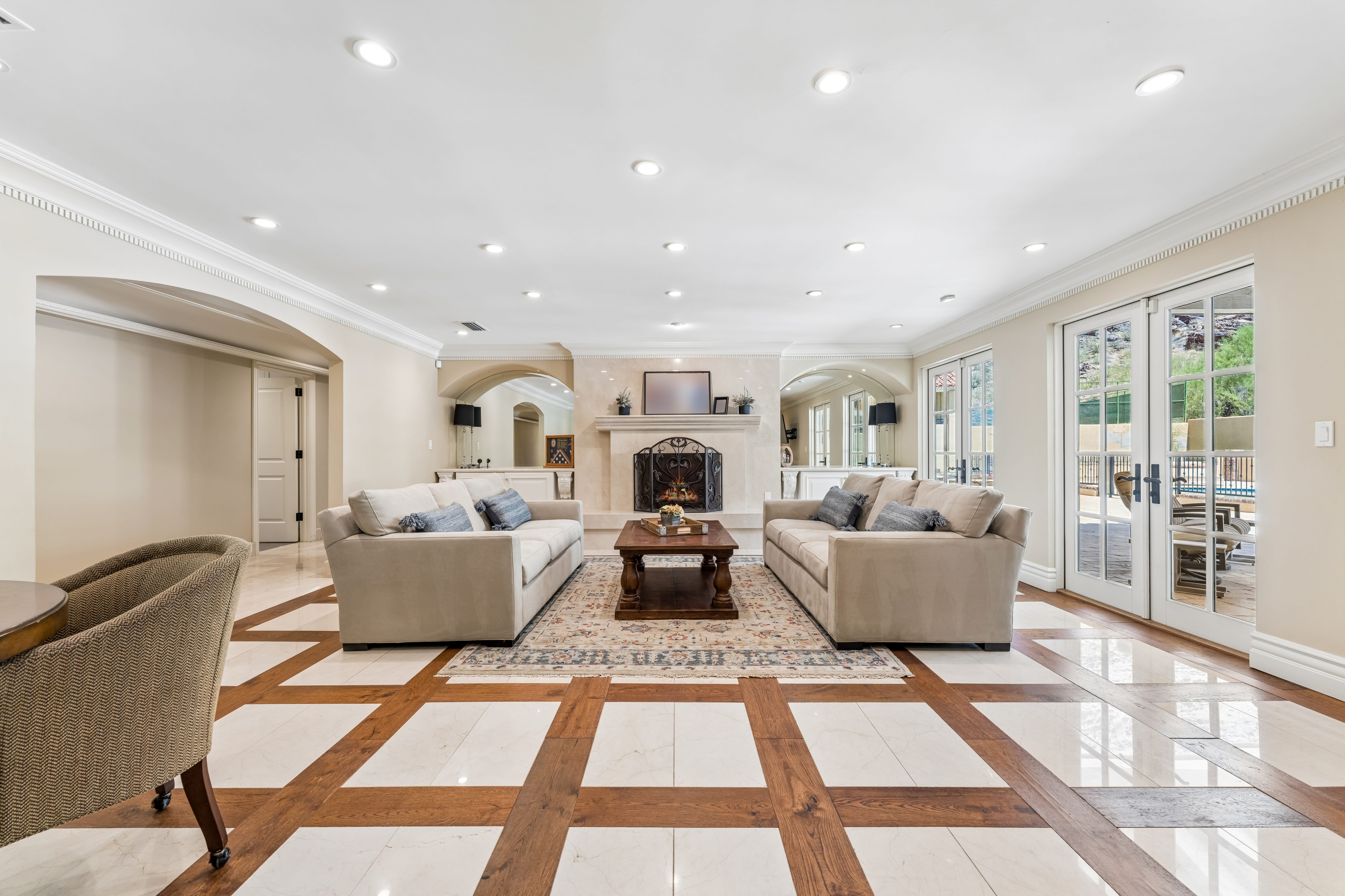 Family room with marble and hardwood checkerboard floor