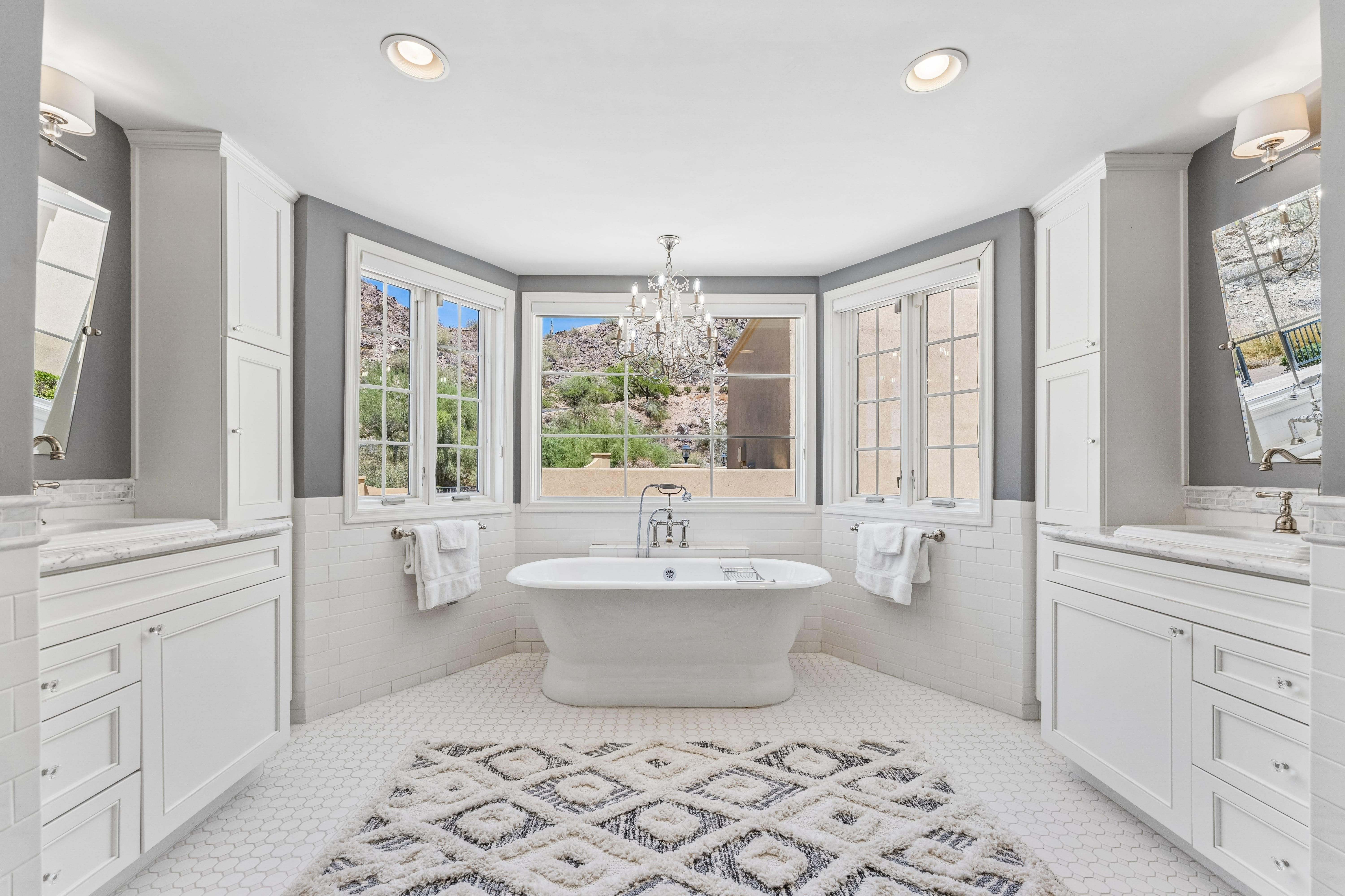 Guest bath with freestanding soaking tub and mountain view