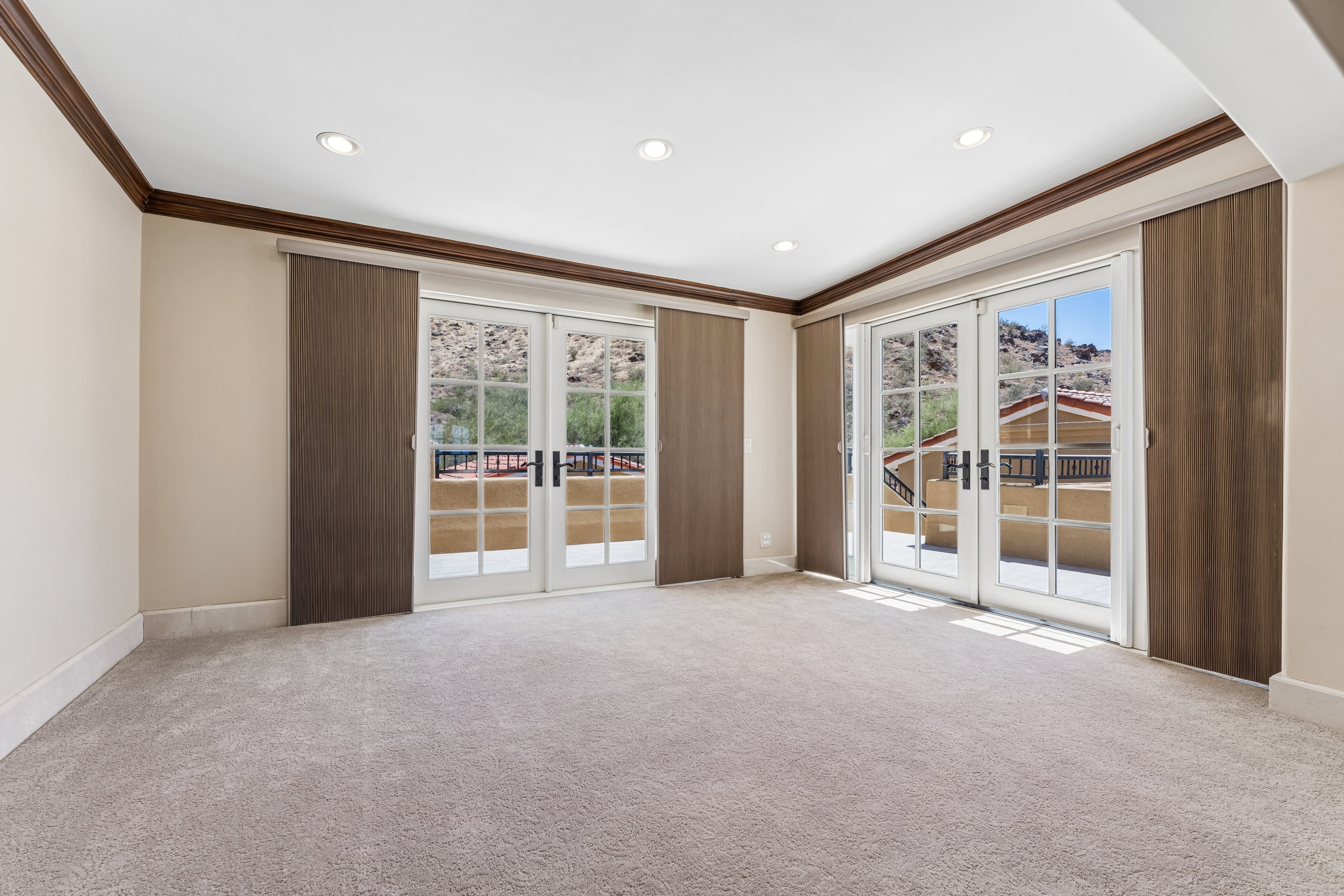 Second floor with French doors to private mountain-view balcony