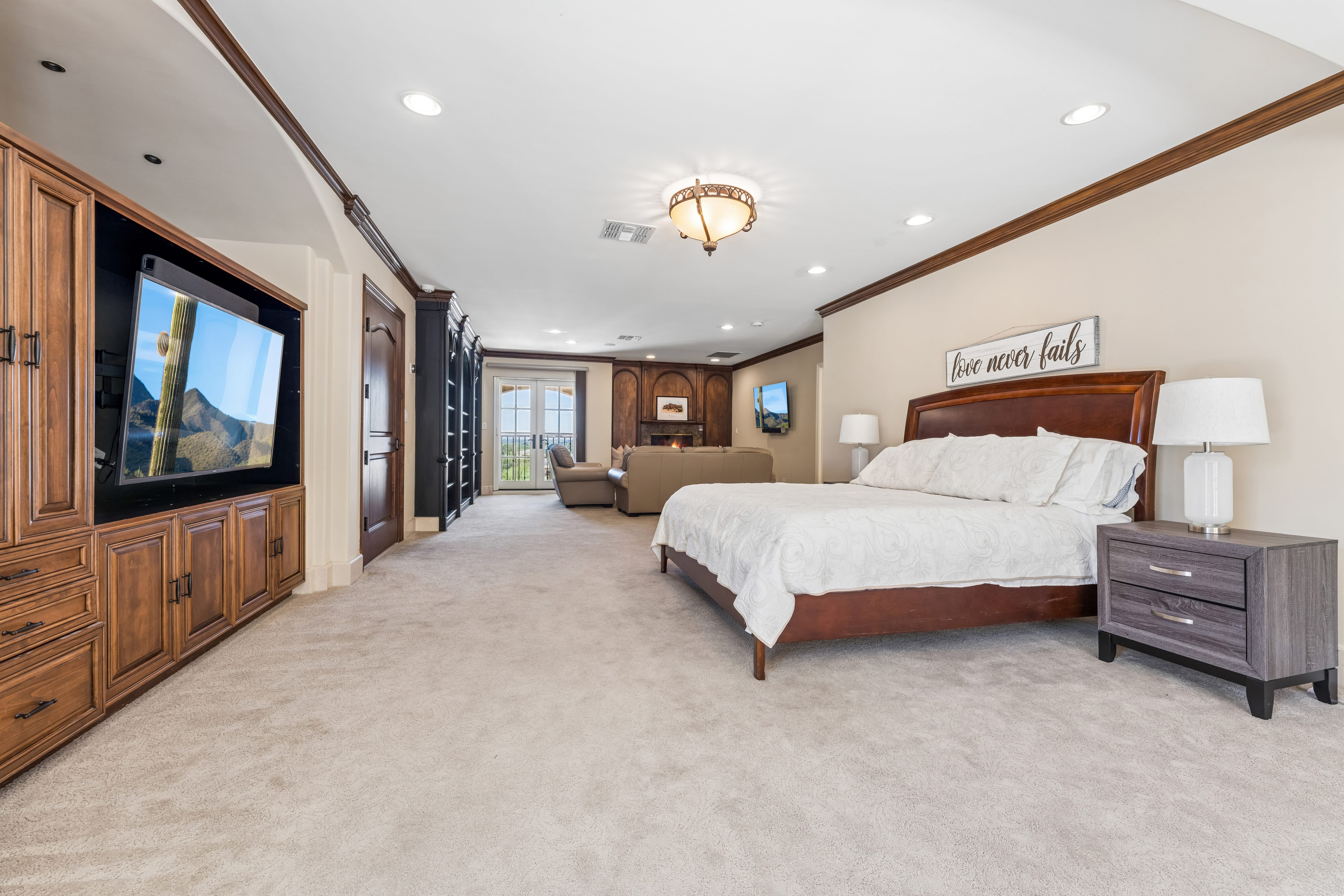 Second floor bedroom with built-in entertainment wall