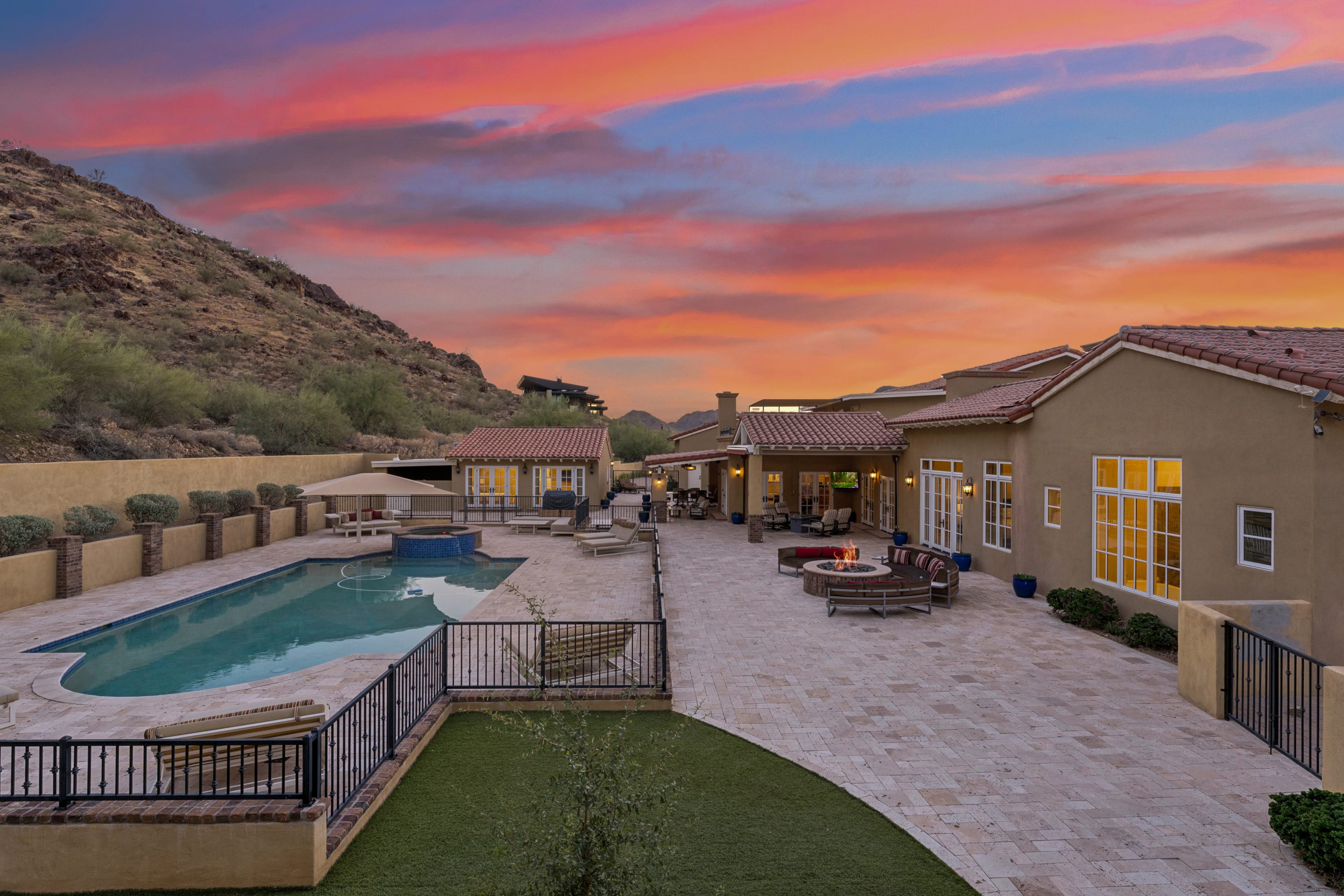 Sunset terrace overview with pool and fire pit